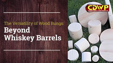 Wooden bungs of various sizes sit next to each other in grass text reads the versatility of wood bungs beyond whiskey barrels