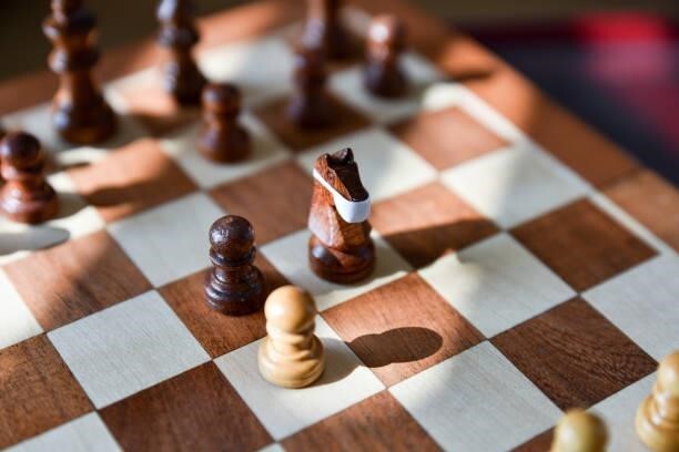 a wooden chess board made of multiple kinds of wood