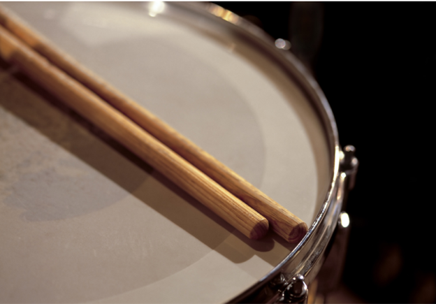 drumsticks on top of a drum